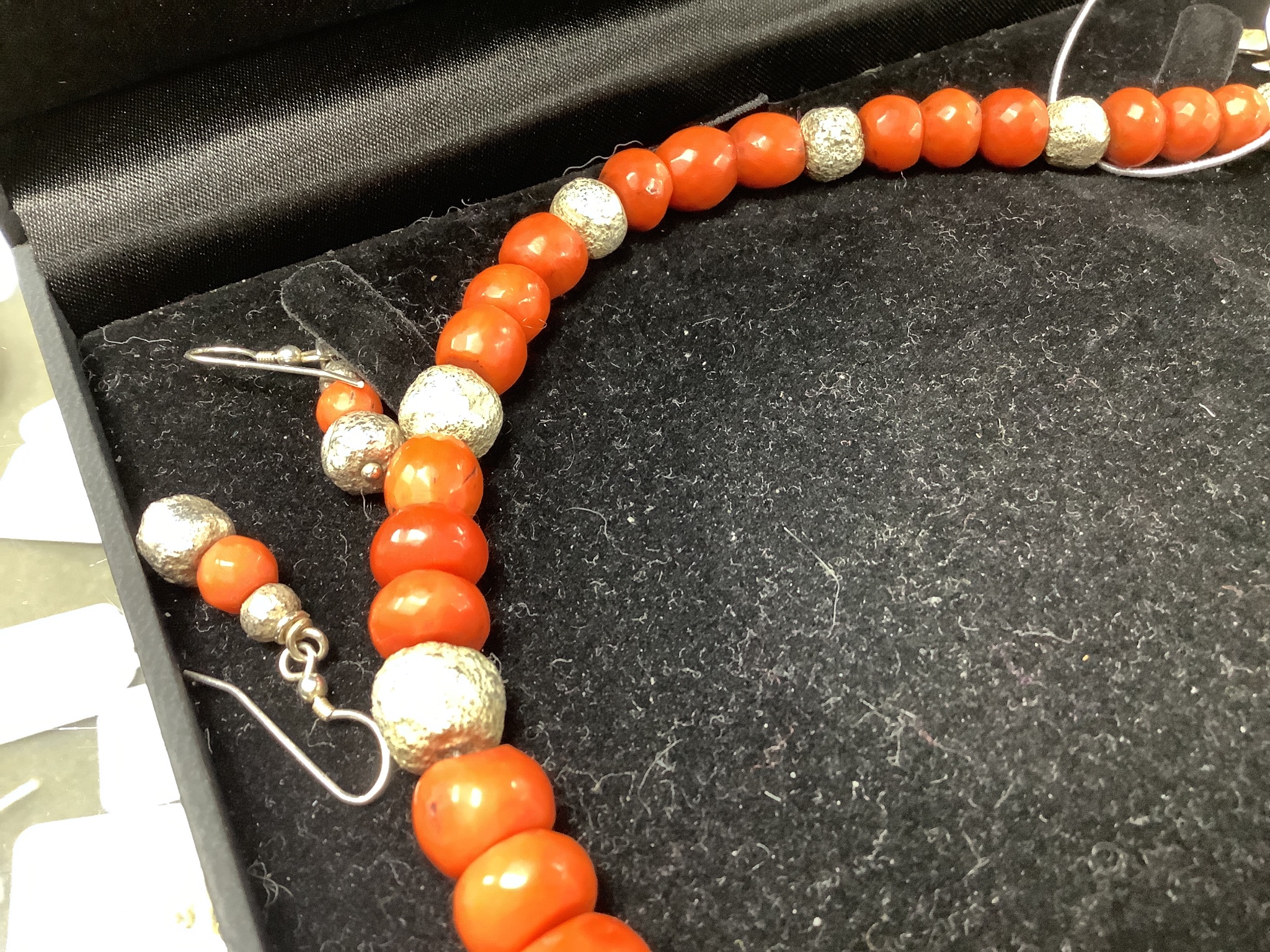 A modern Pruden Smith coral and white metal bead necklace, approx. 42cm and a pair of matching drop earrings